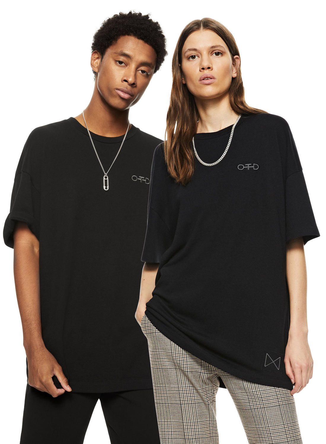 Man & Woman in Black Oversized Crewneck Tee